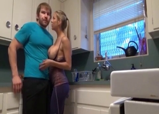 Blond-haired beauty blows her son